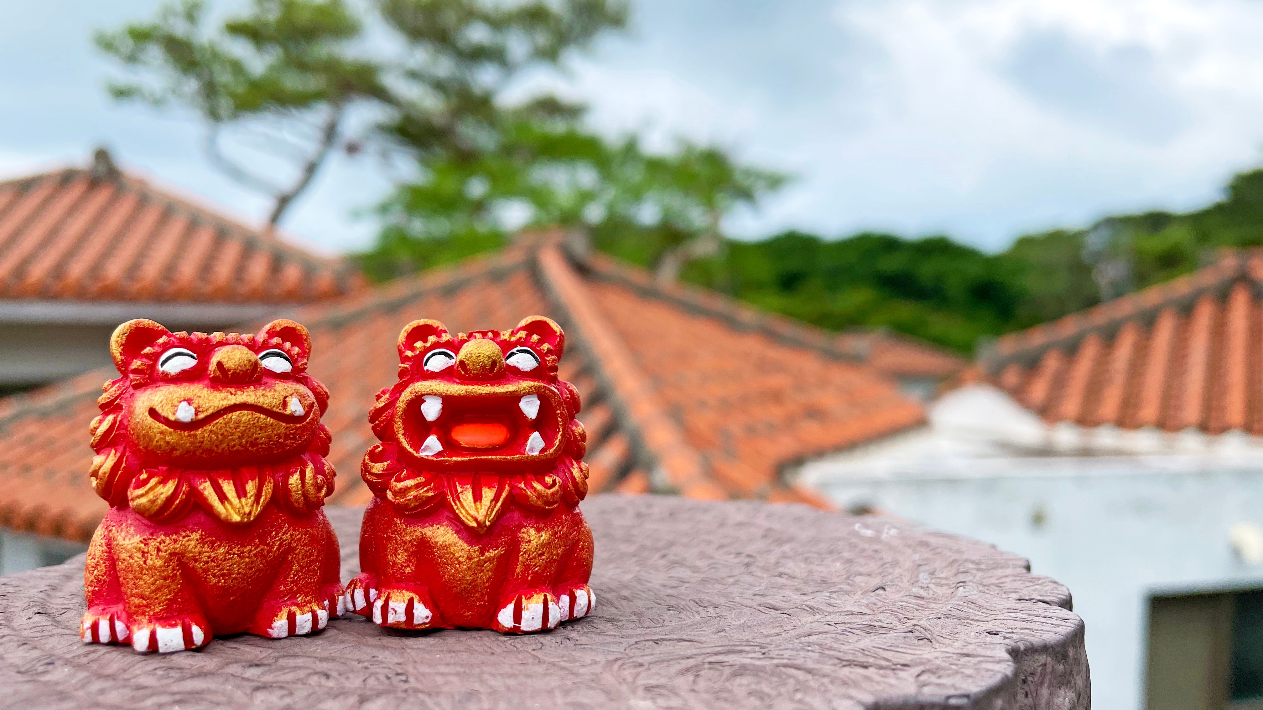 Pair of red Okinawan shisa lions 
