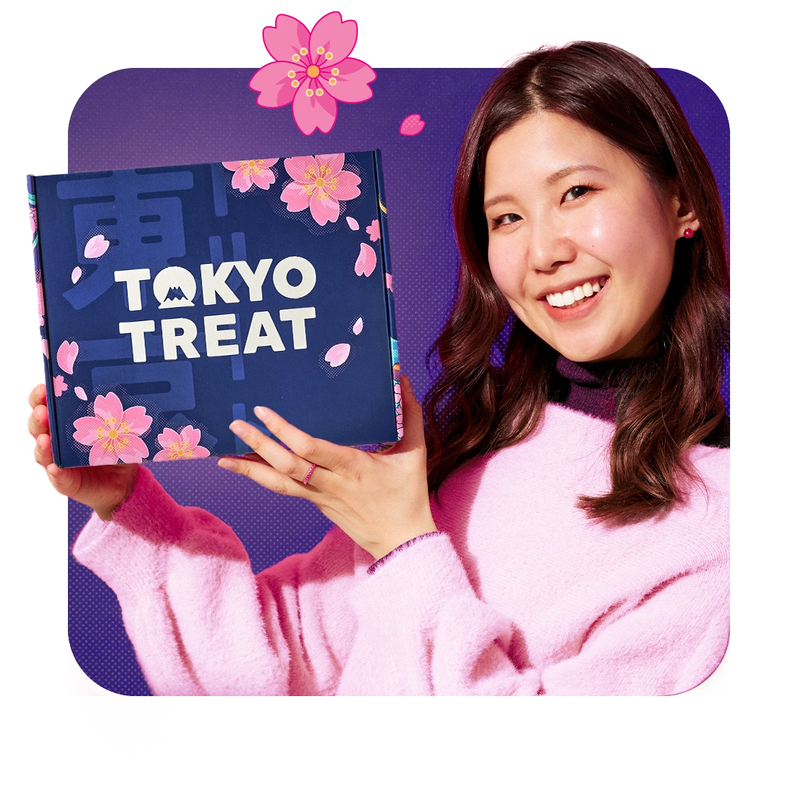 A Japanese girl holding the Sakura Nights Snackfest box! 