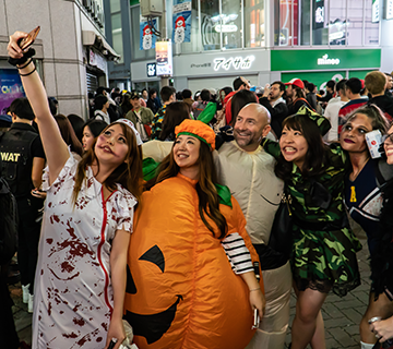 People in costumes celebrating Halloween in Shibuya.