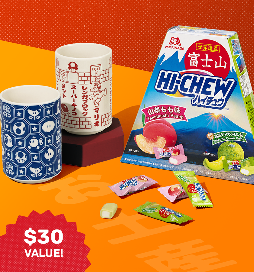 Character tea cup and KitKats on red/orange background 
