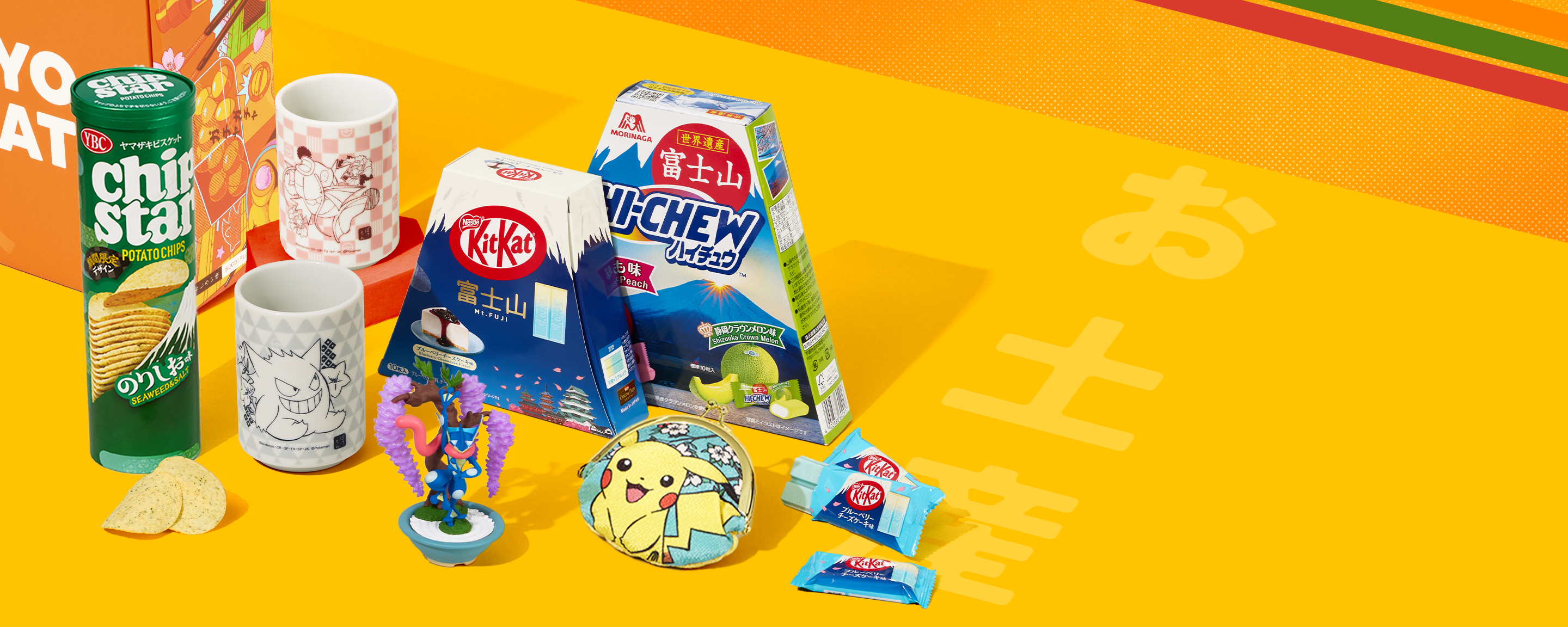 Japan character merch and snacks on yellow background with stripes 