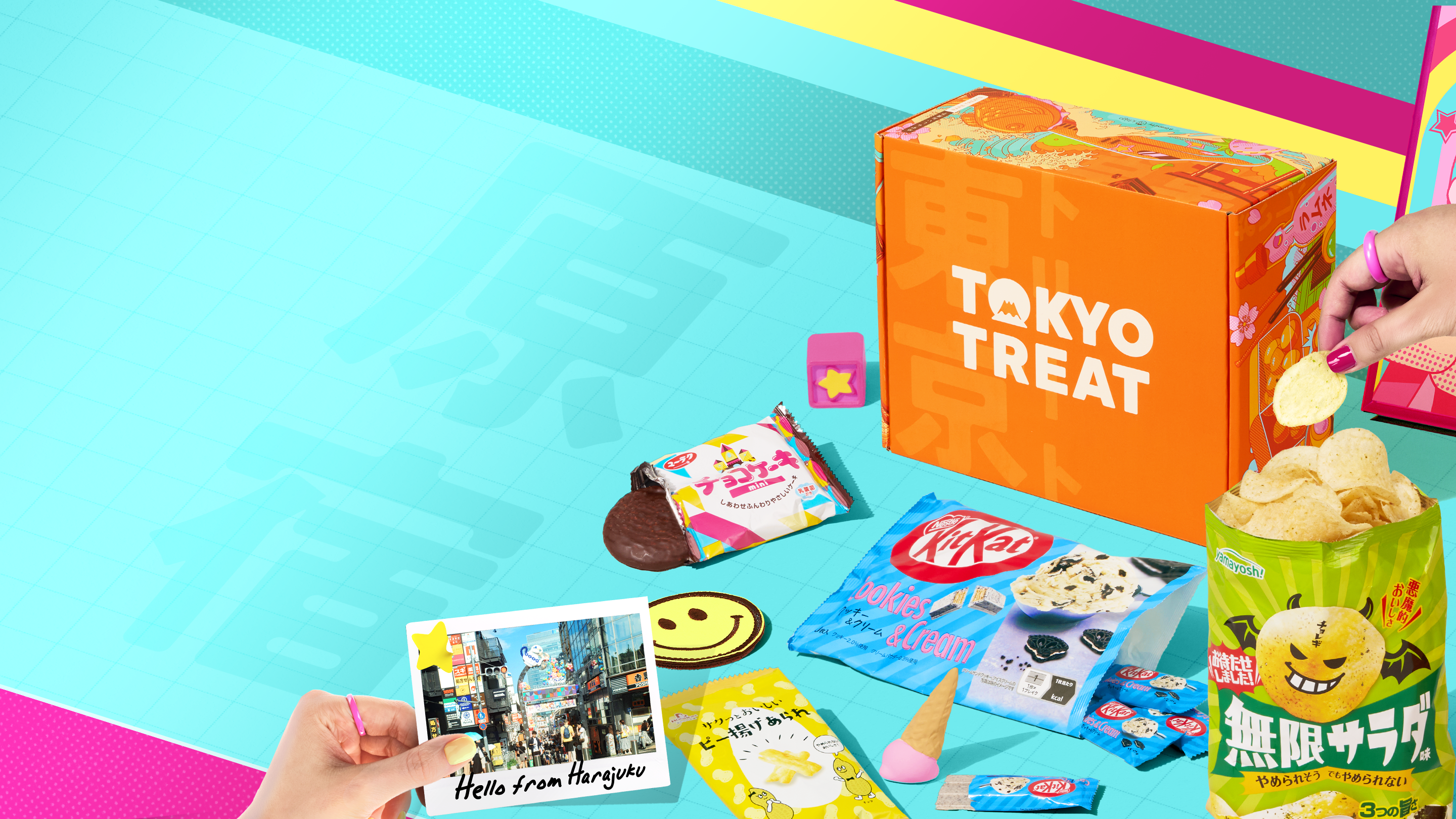 Orange TokyoTreat box with Harajuku-themed snacks around it on neon background 
