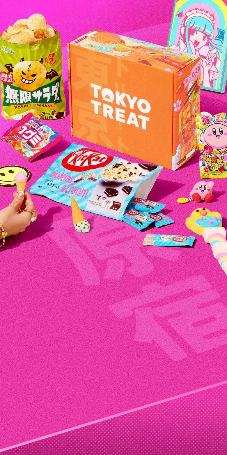TokyoTreat box on pink background with Harajuku-themed snacks around it 