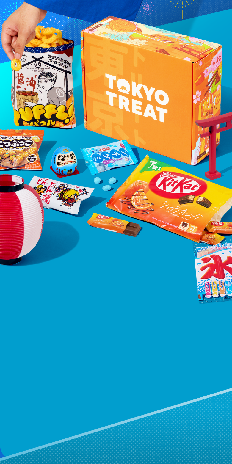 TokyoTreat box with matsuri-themed snacks around it on blue background 