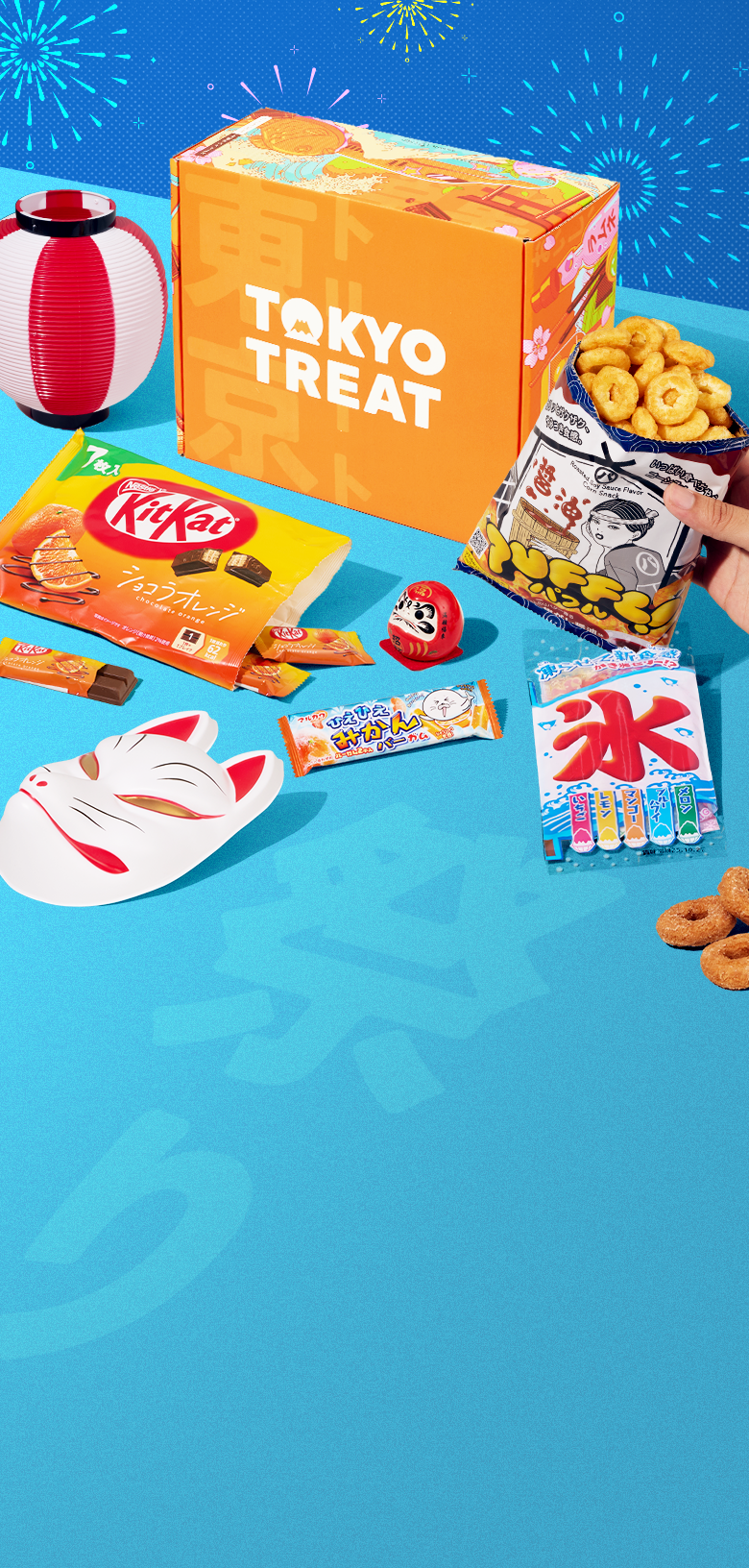 Orange TokyoTreat box with matsuri-themed treats on blue background 
