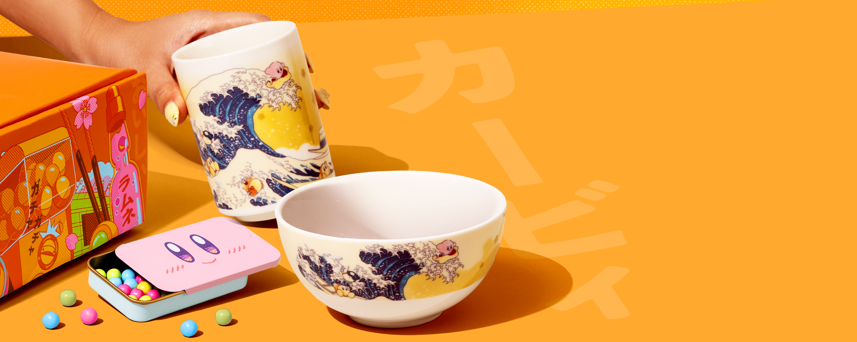 Kirby merch and snacks on a yellow background 