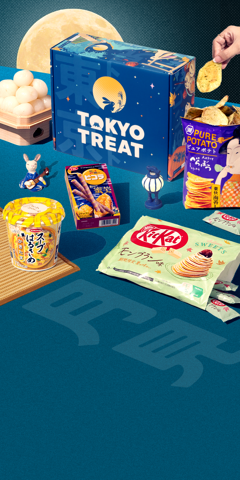TokyoTreat tsukimi box with moon-themed snacks around it on blue background with moon