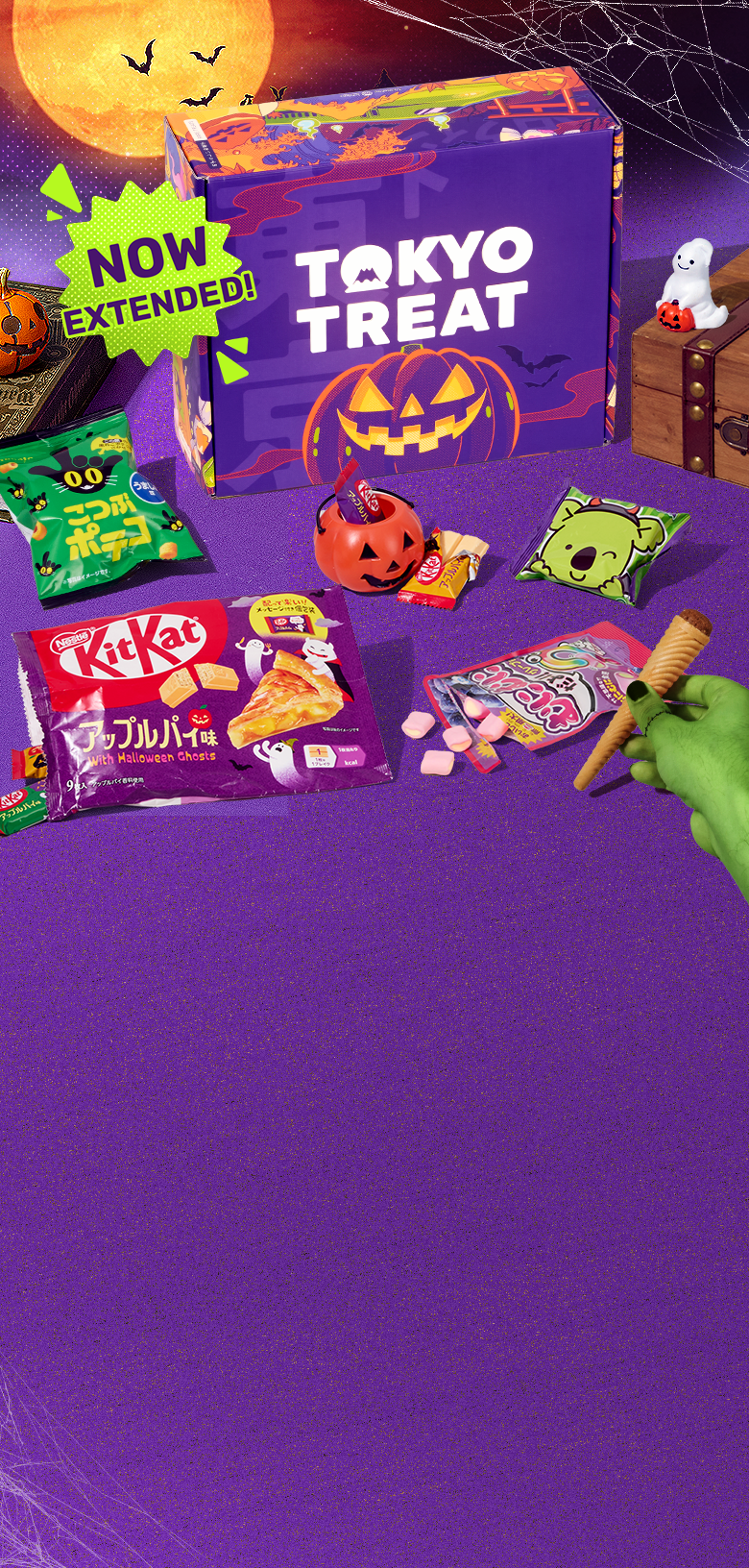 TokyoTreat Halloween box with Halloween-themed snacks around it on purple background with green hand