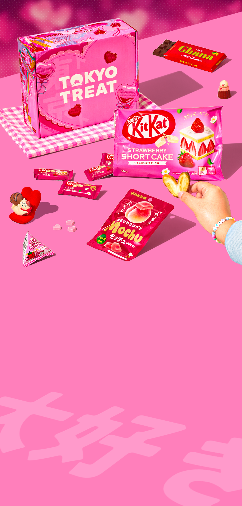 TokyoTreat Valentine's Day box with lots of pink and red snacks on a pink background 