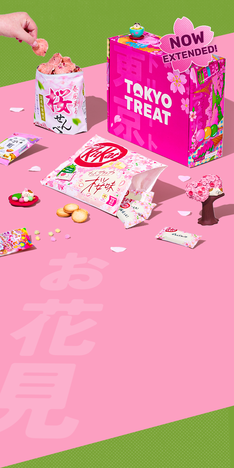 Pink TokyoTreat box with sakura-themed snacks on pink background 