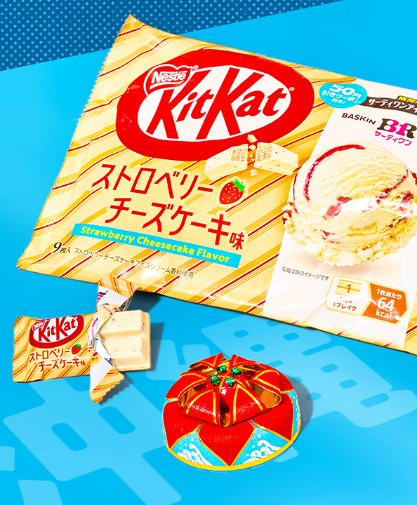 A pack of Strawberry Cheesecake Kitkat in a blue background