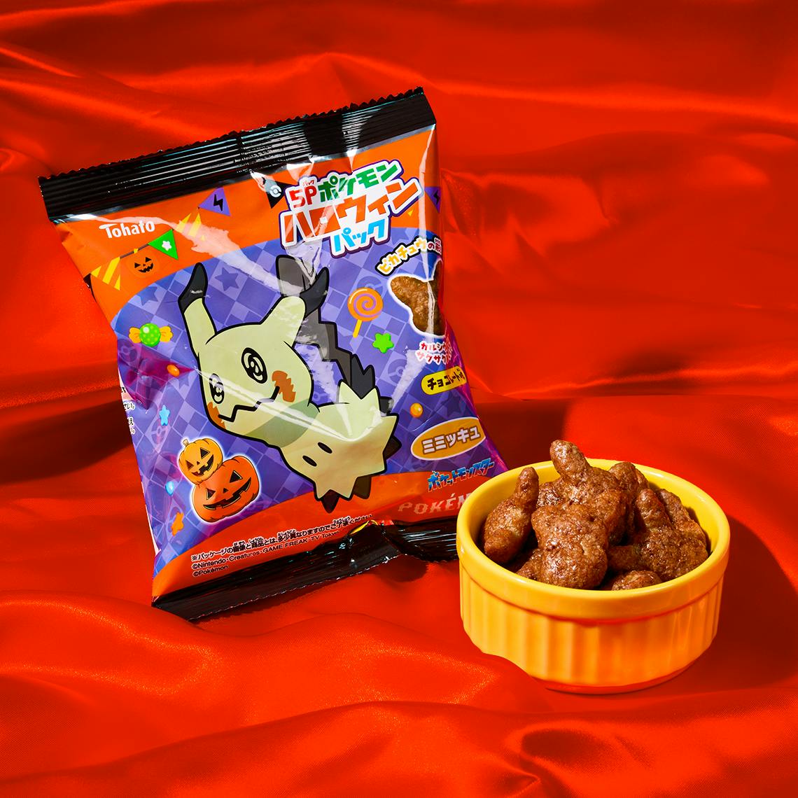 Chocolate-flavored corn puffs with a random Pokémon design pack in a red background