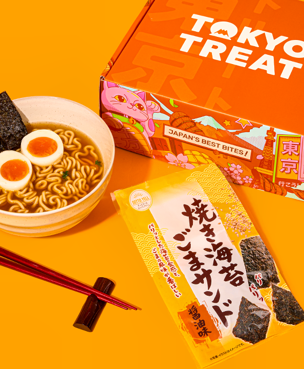 Seaweed chips and ramen against an orange background