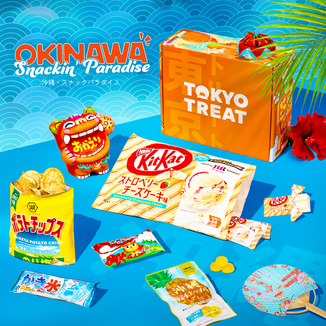 Orange TokyoTreat box with Okinawa snacks around it on a blue background