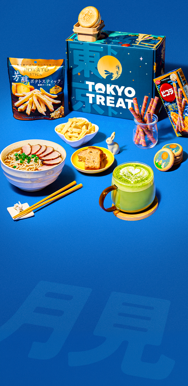 A blue box surrounded by Japanese snacks on a blue background