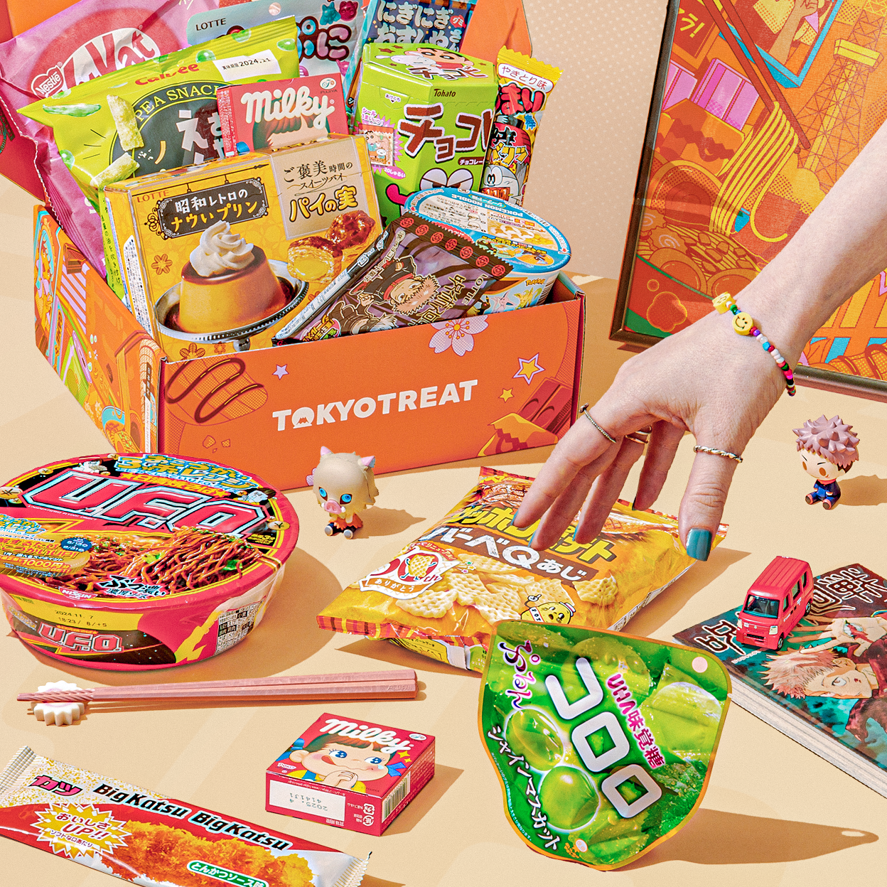 Orange TokyoTreat box with Japanese snacks on neutral beige background