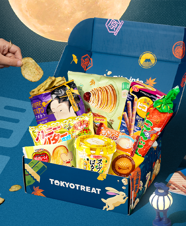 TokyoTreat Tsukimi box with moon-themed snacks on blue background