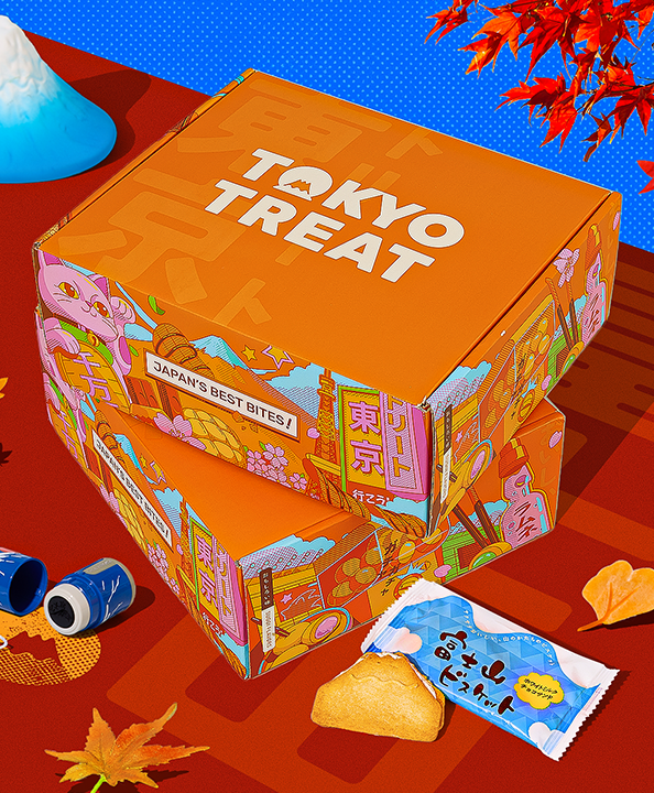 Orange TokyoTreat box with fall themed snacks and Mt. Fuji in the background