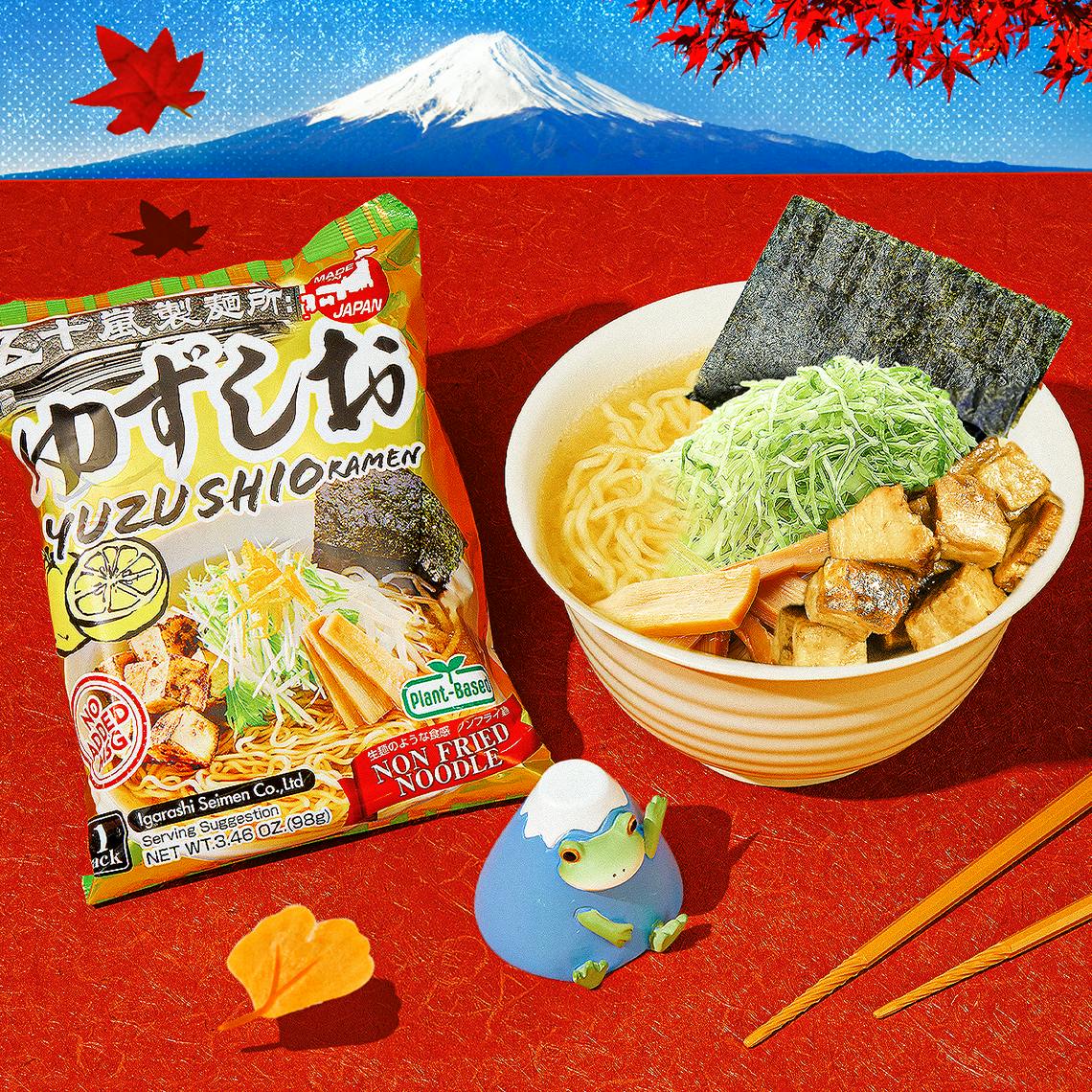 Yuzu shio ramen on red background with Fuji figurine