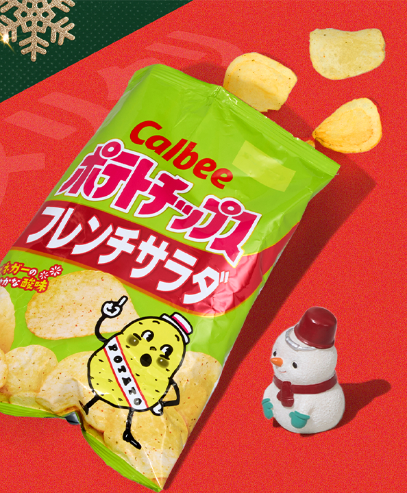 French salad potato chips on red background with snowman figurine around it