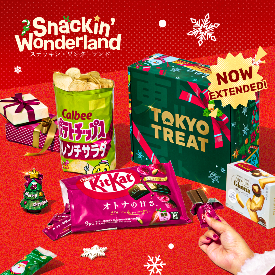 Green TokyoTreat box with holiday-themed treats around it on a red background