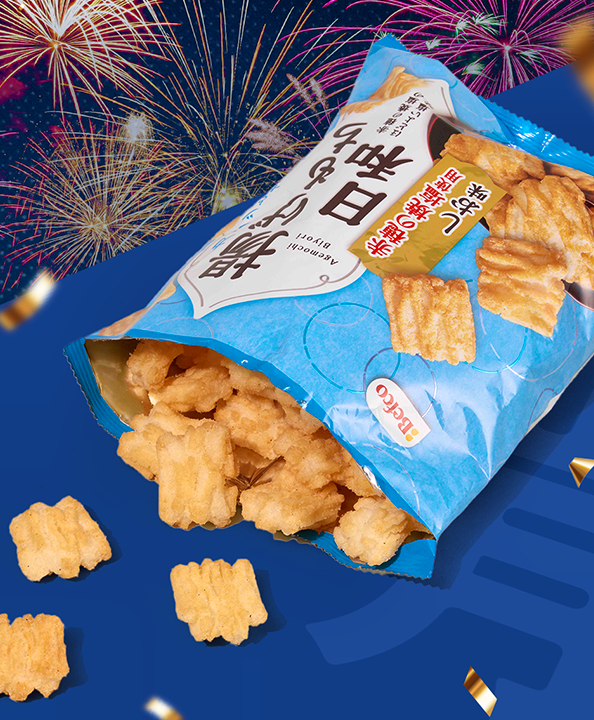 Agemochi bites on blue background with fireworks in the back