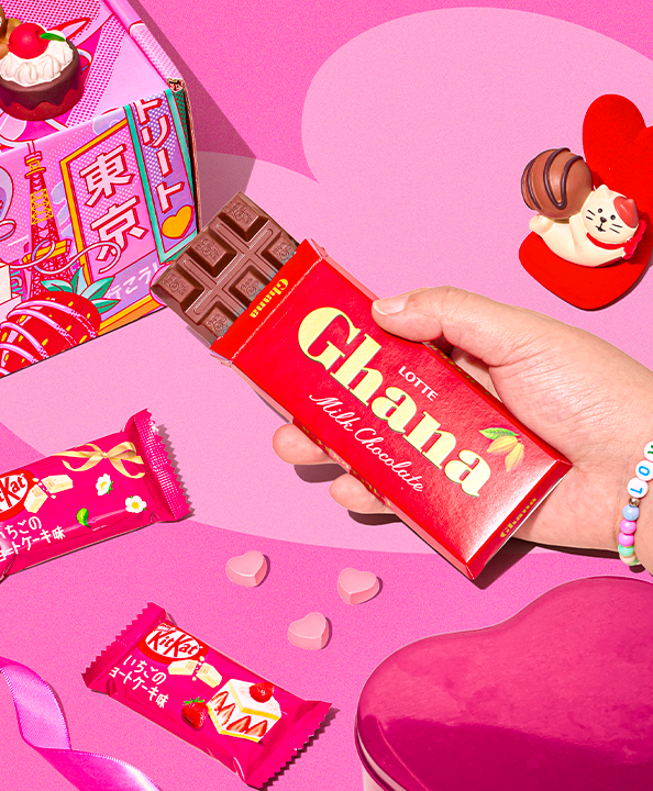 Lotte chocolate bar on pink background with Valentine's Day decorations