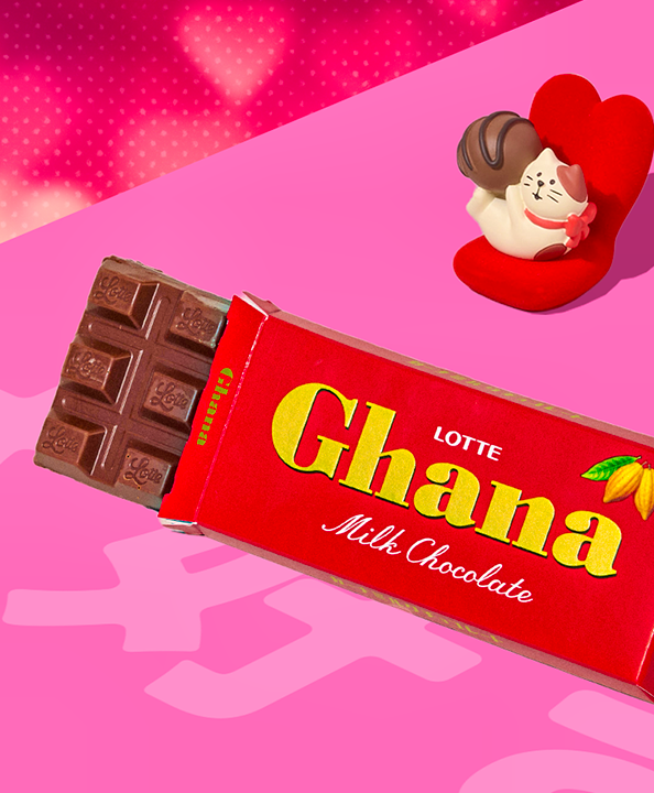 Lotte chocolate bar on pink background with Valentine's Day cat figurine on the side