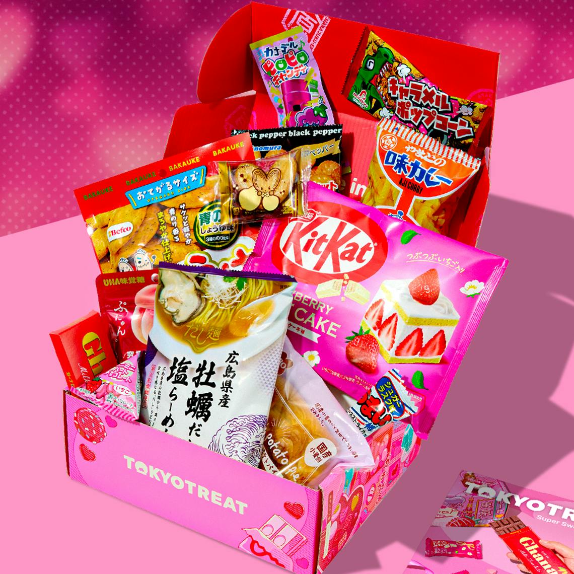 Super Sweet Valentine box with Valentine's day snacks on pink background