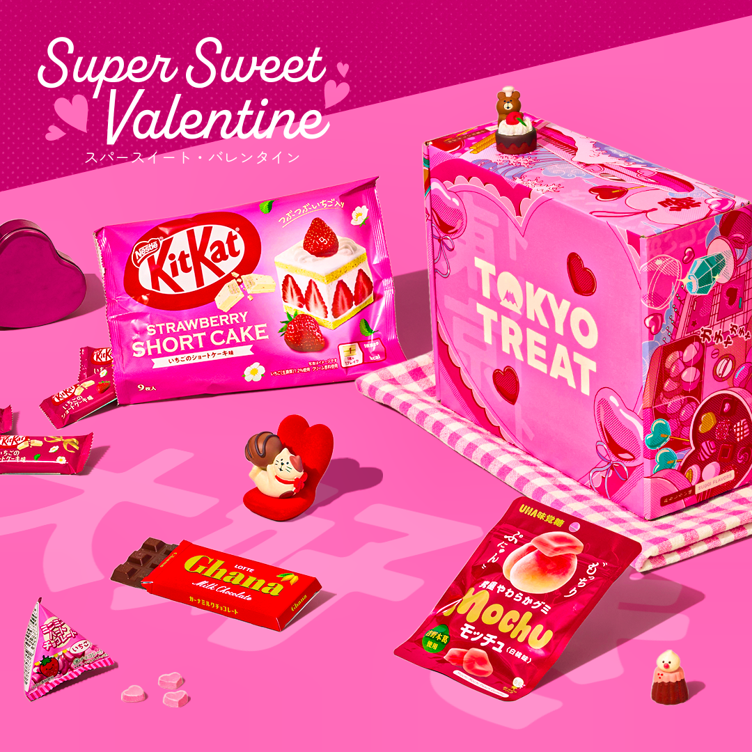 TokyoTreat Valentine's box on pink background with lots of red and pink treats around it