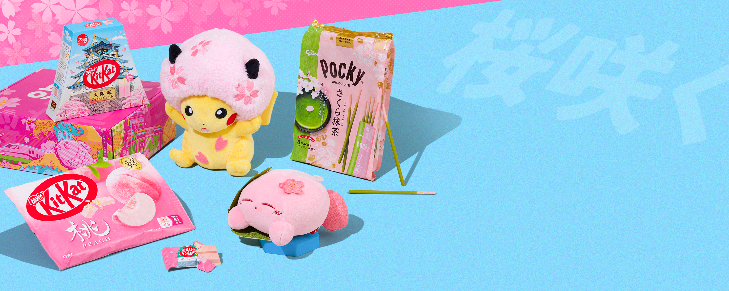 Sakura snacks and Pokémon & Kirby sakura plushie on blue background