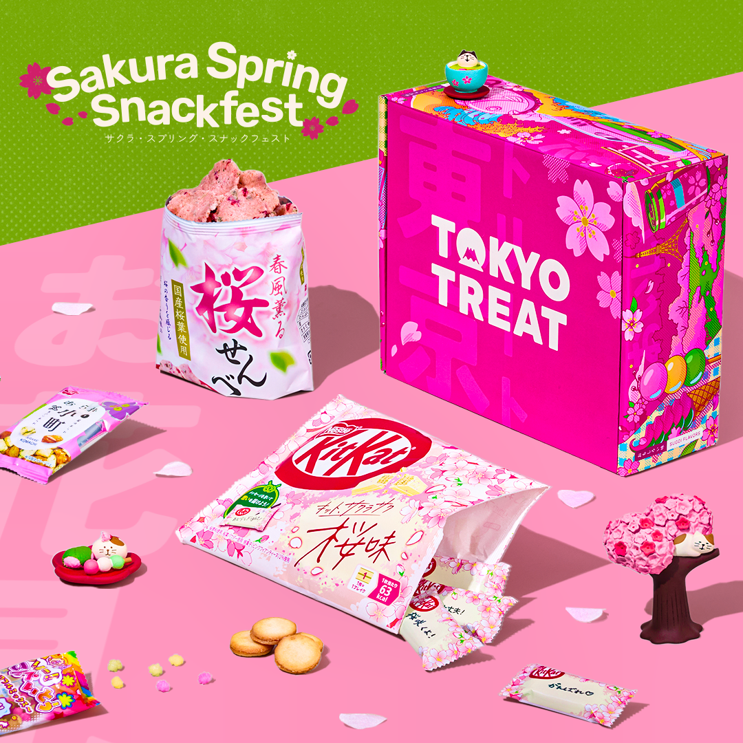 Pink TokyoTreat box with sakura-themed snacks around it on pink background