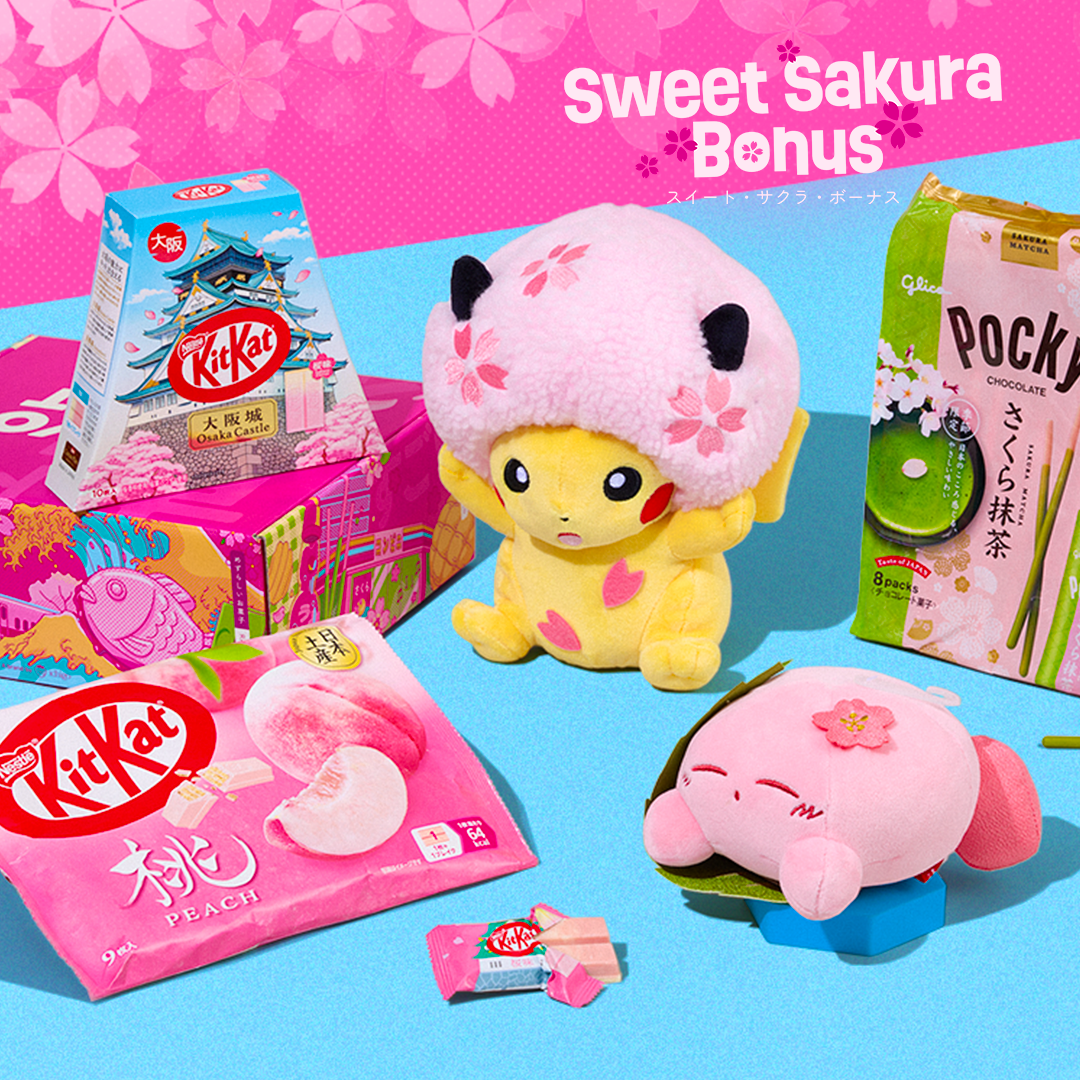 Sakura snacks and character plushies on blue background with cherry blossoms in the back