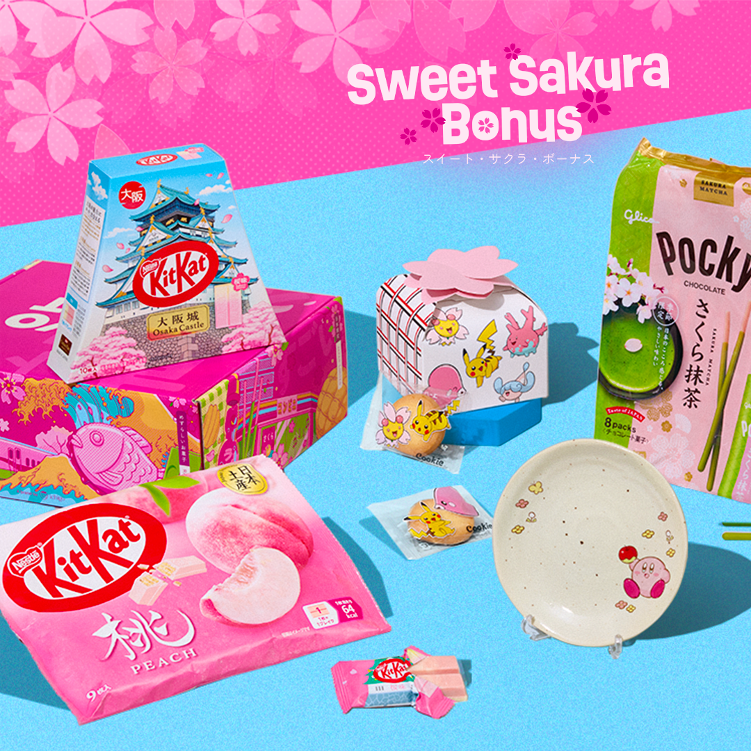 Sakura snacks and Kirby plate on blue background with cherry blossoms in the back