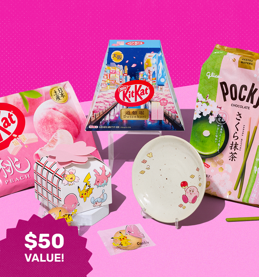 Assorted sakura snacks and Kirby plate on pink background