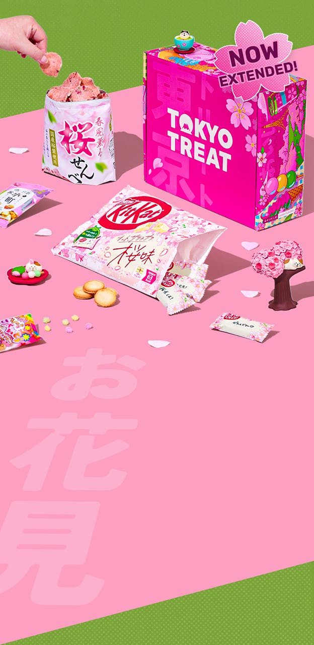 Pink TokyoTreat box with sakura-themed snacks on pink background