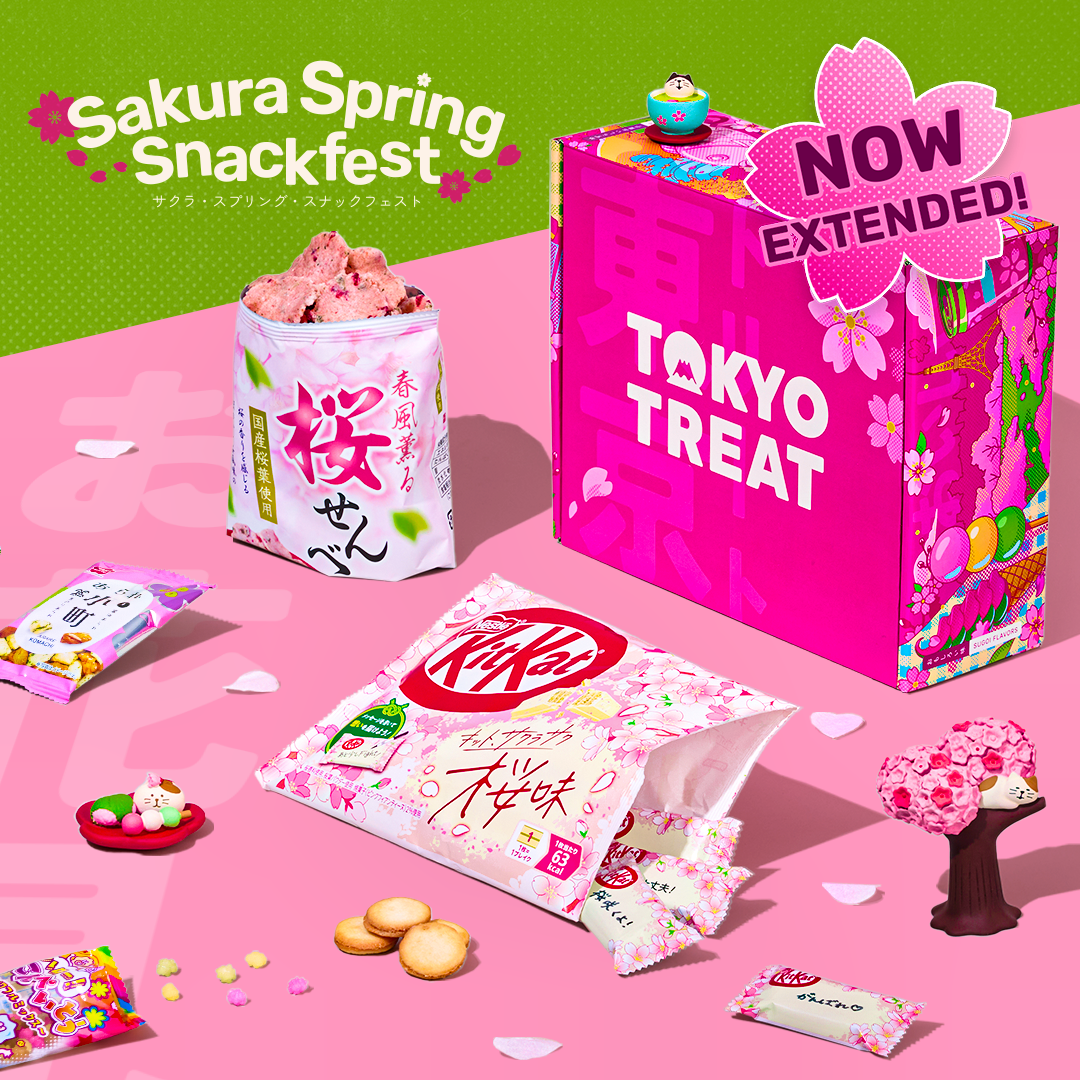Pink TokyoTreat box with cherry blossom snacks around it