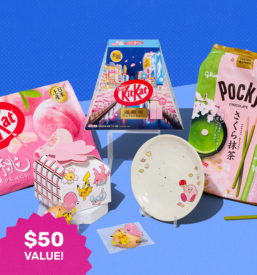 Assorted sakura snacks and Kirby plate on blue background