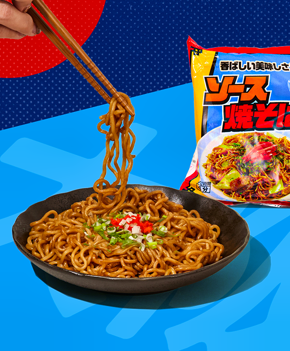 Plate of yakisoba on blue background