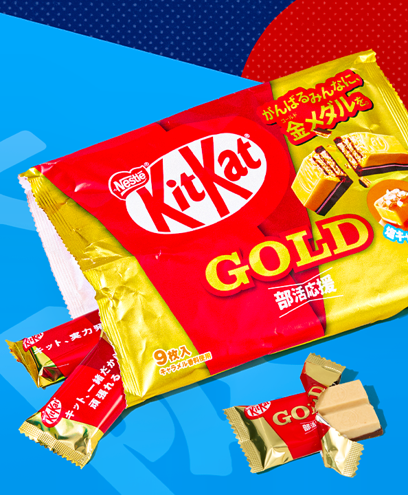 Salted Caramel KitKats on blue background with red sun in the back