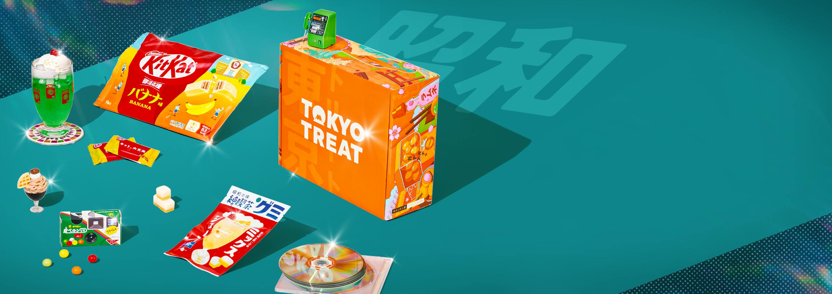Orange TokyoTreat box with retro-themed snacks around it on teal background