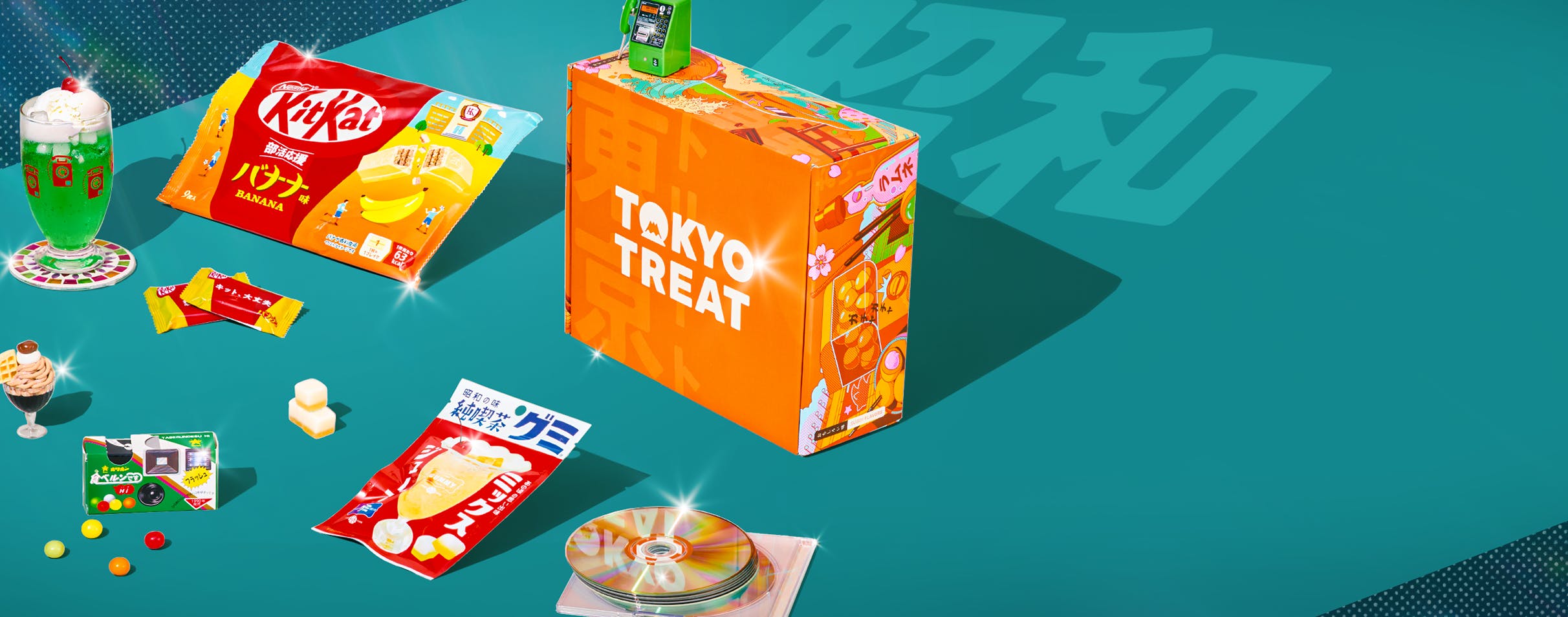 Orange TokyoTreat box with retro-themed snacks around it on teal background