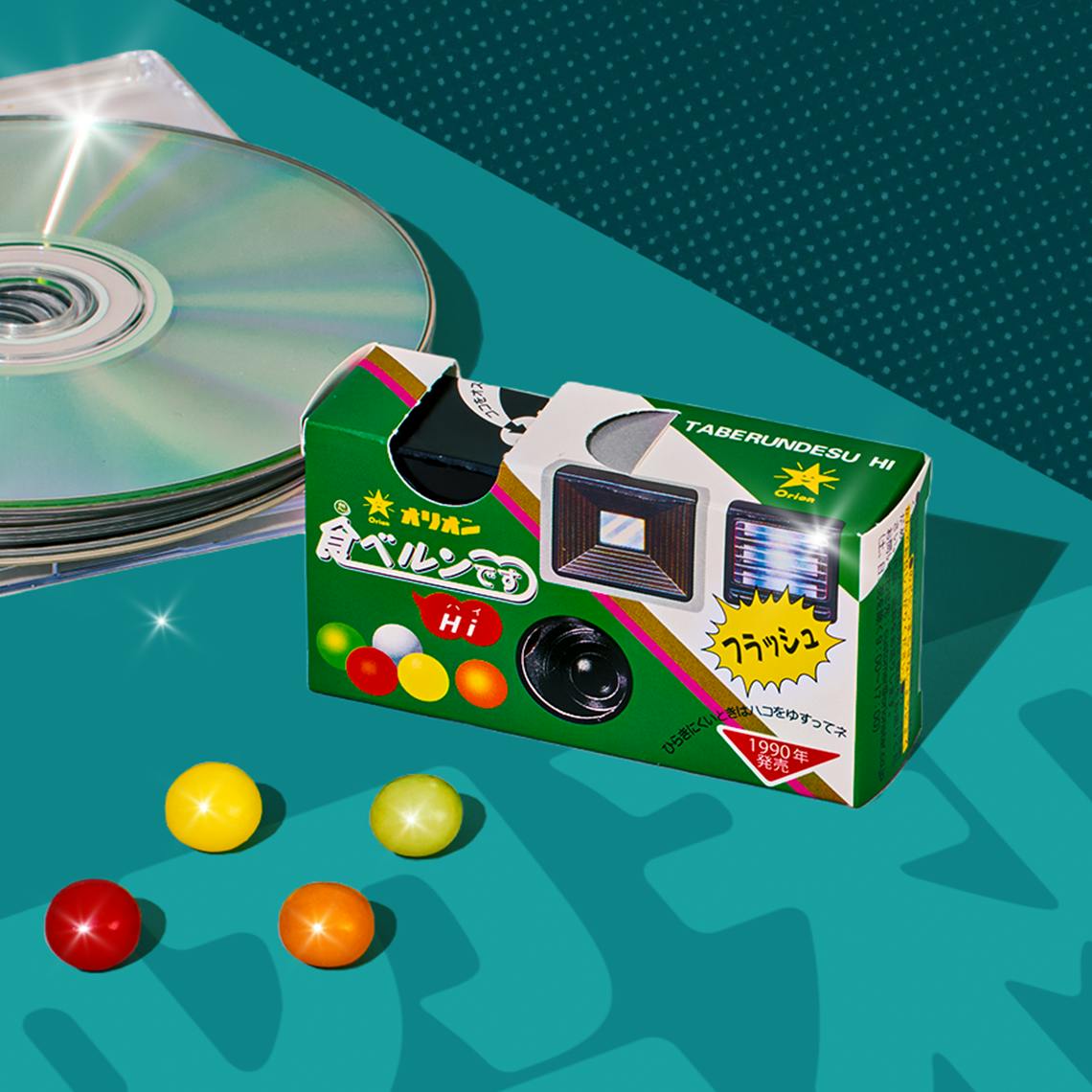 Camera Ramune Candy on teal background