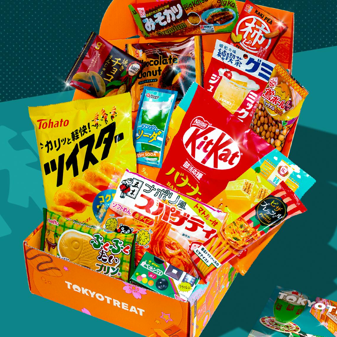 Orange TokyoTreat box opened with retro-themed snacks on teal background