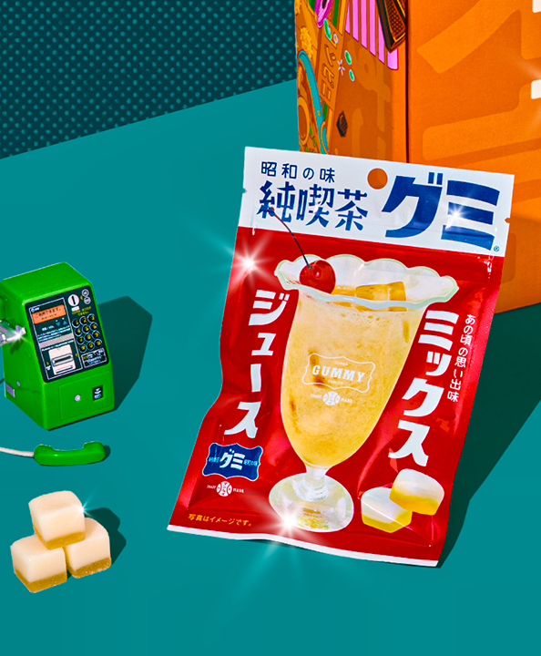 Mixed Juice gummies on teal background laying against orange TokyoTreat box