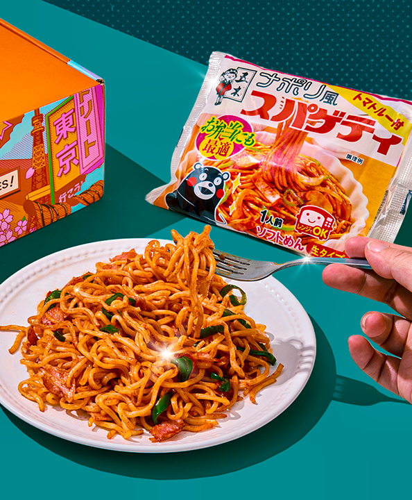 Napolitan spaghetti on white plate with orange TokyoTreat box on teal background