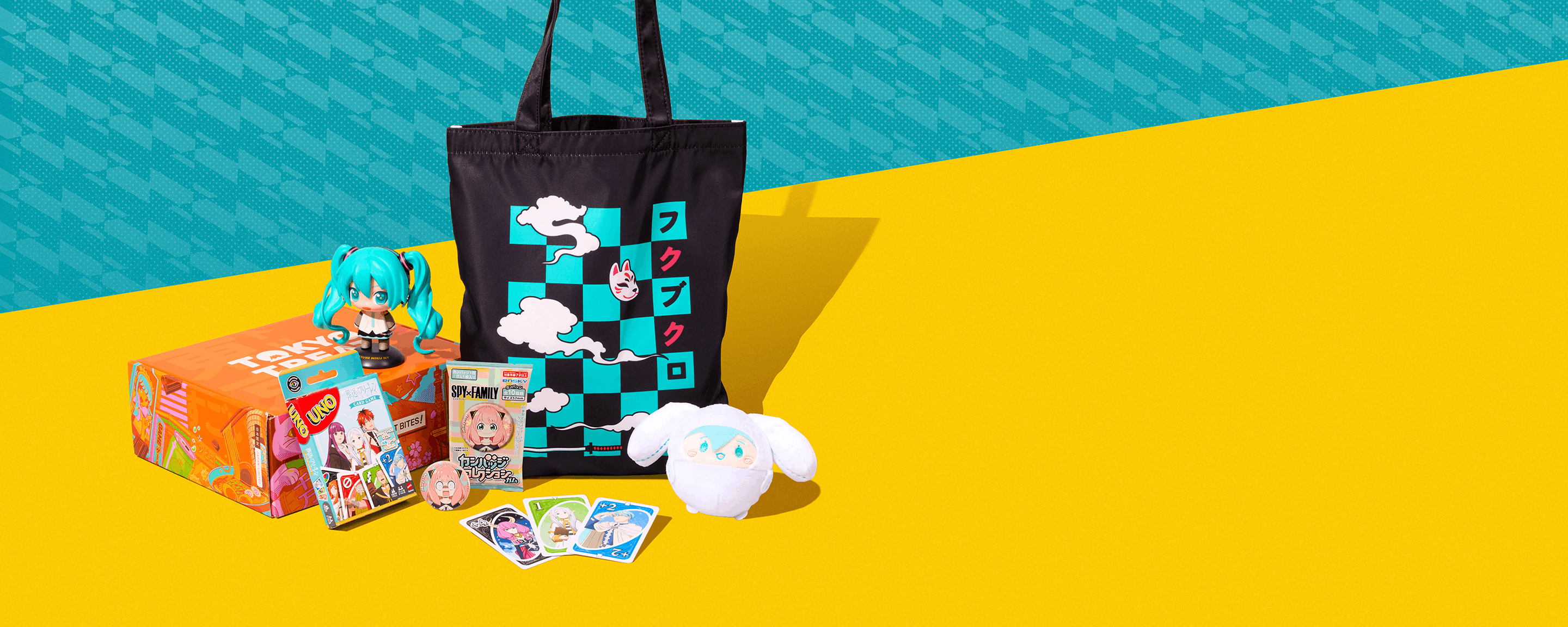 Assorted Japanese anime merch on yellow background with teal in the back