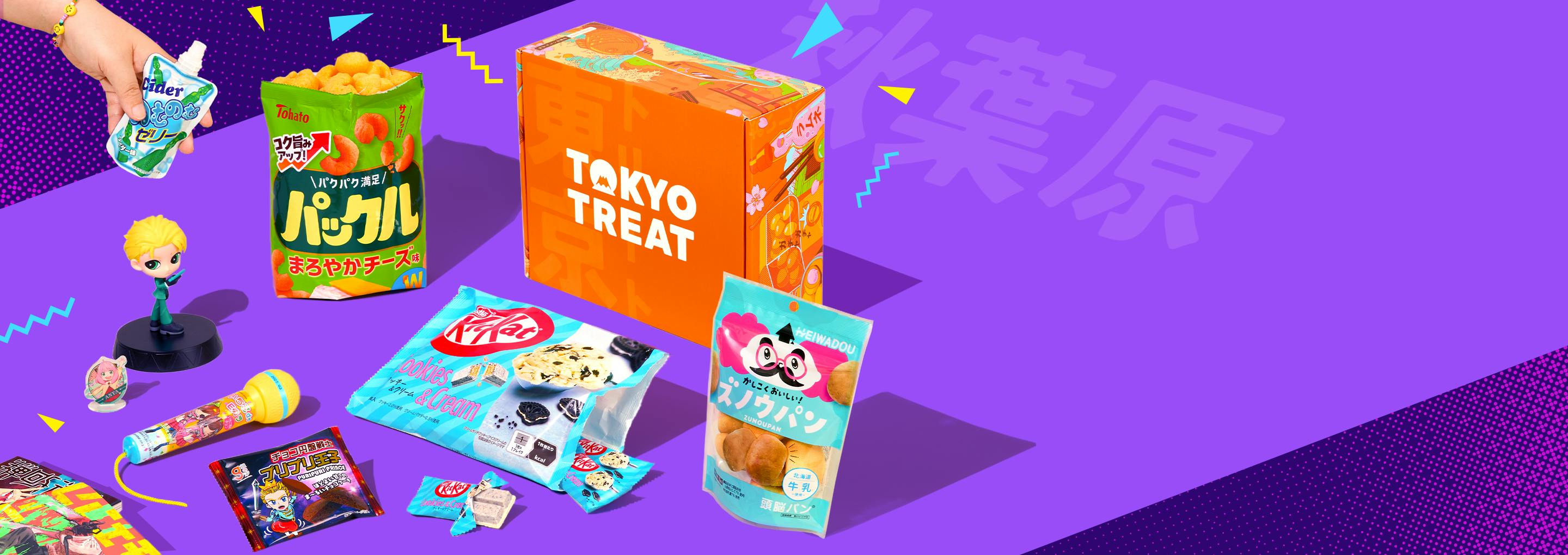 Orange TokyoTreat box with Akiba-themed snacks around it on purple background