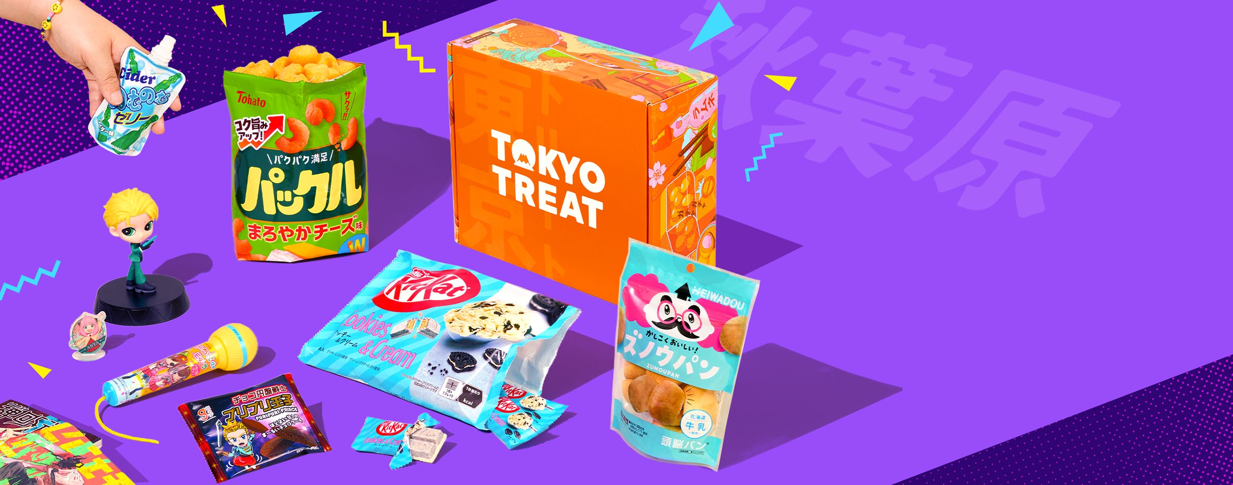 Orange TokyoTreat box with Akiba-themed snacks around it on purple background