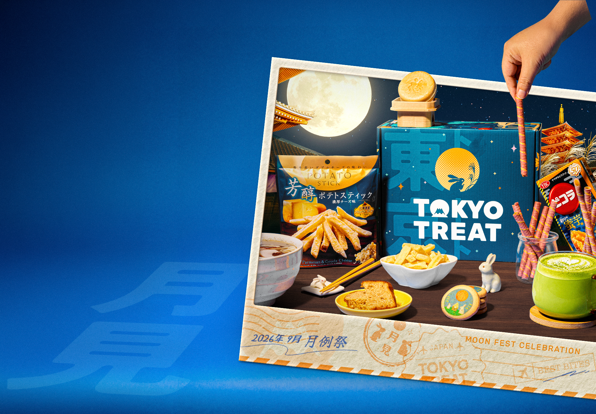 A blue box surrounded with snacks inside a polaroid photo on a blue background